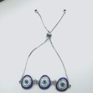 Stainless steel sliding adjustable evil eye bracelet.